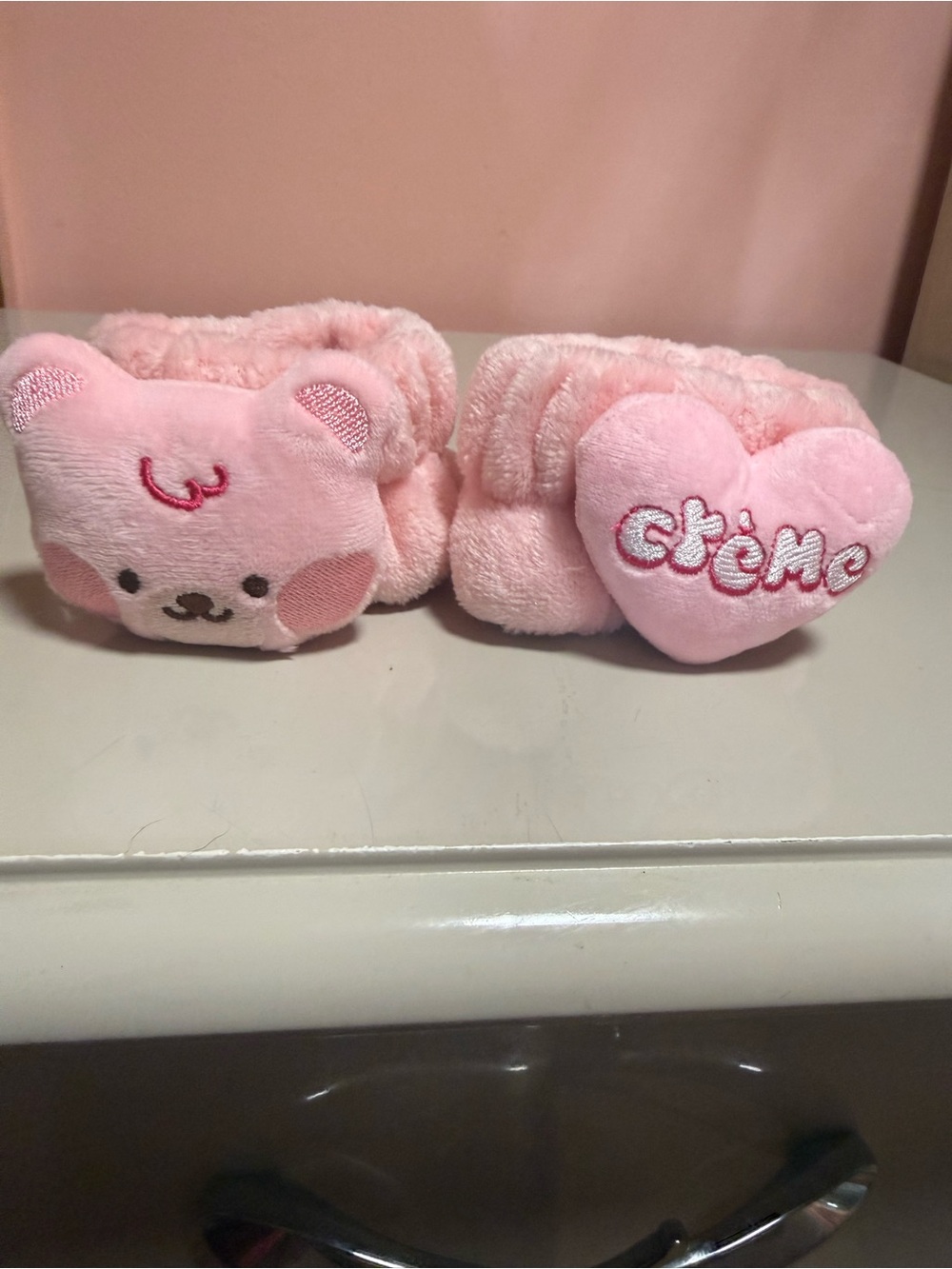 Crème Shop teddy wrist cuff set features ultra-plush pink bear heads